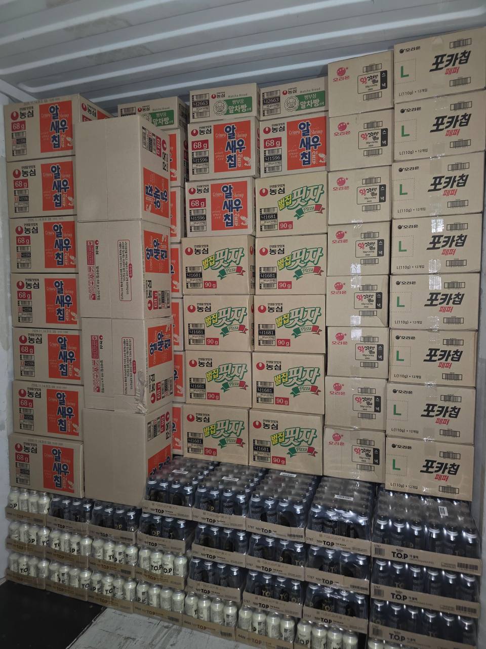 Korean snack cartons stacked in a container