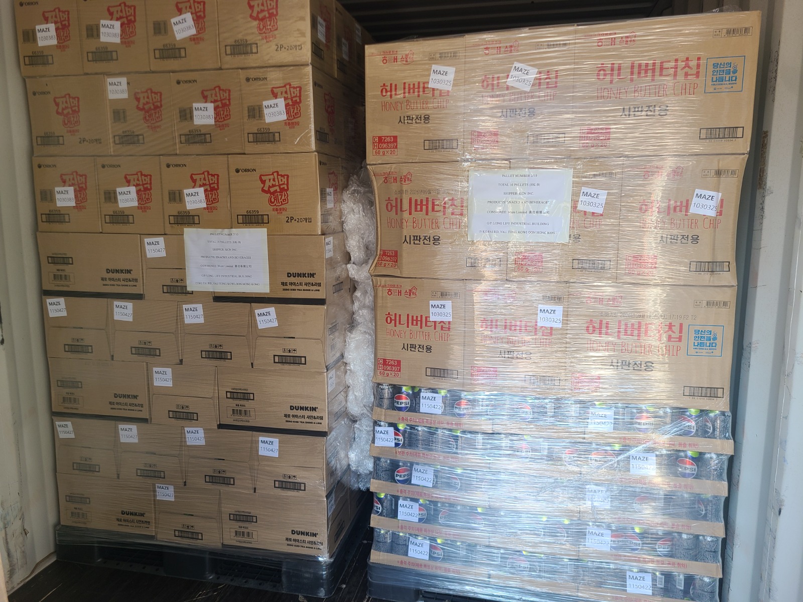 Snack and beverage cartons arranged in a container