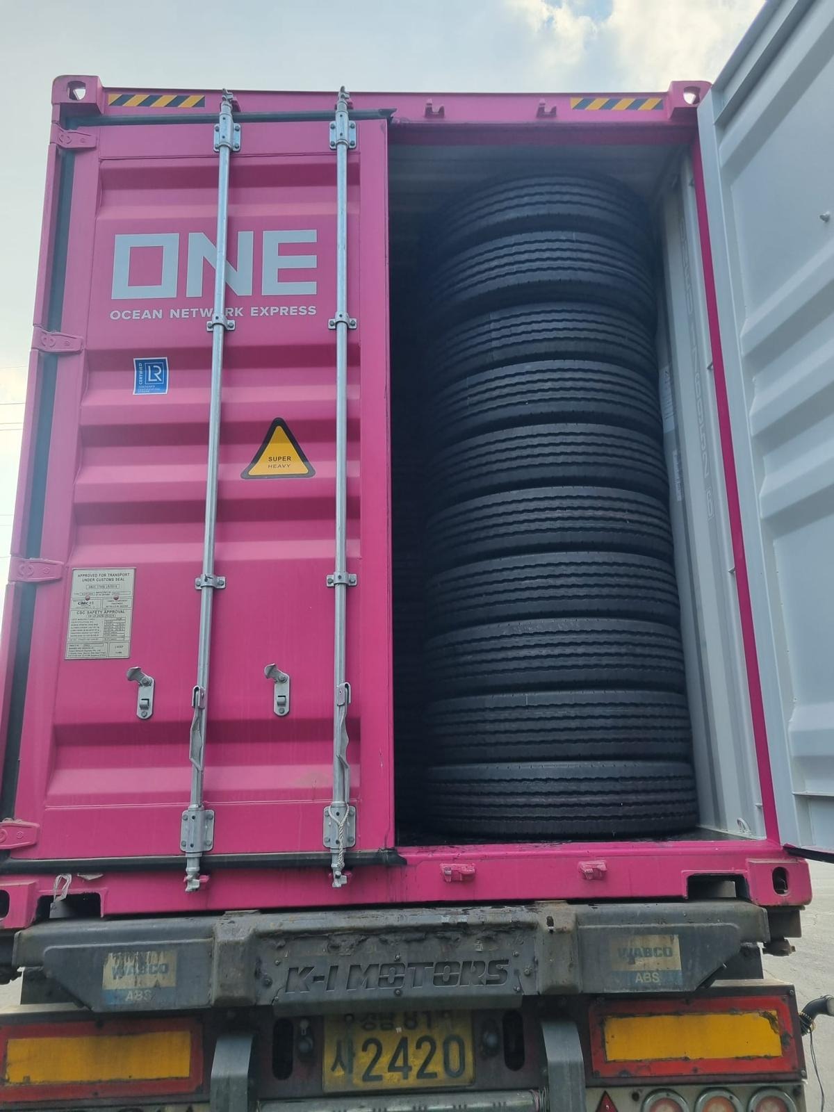 Truck tyres stacked inside a shipping container